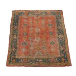 An Ushak carpet, the orange field interspersed with flowerheads and palmettes   An Ushak