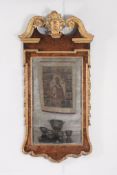 A George II walnut and parcel gilt wall mirror, circa 1735   A George II walnut and parcel gilt wall