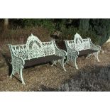 A pair of painted cast iron garden seats, last quarter 19th century   A pair of painted cast iron