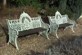 A pair of painted cast iron garden seats, last quarter 19th century   A pair of painted cast iron