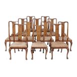 A set of twelve walnut dining chairs in George II style   A set of twelve walnut dining chairs in