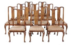 A set of twelve walnut dining chairs in George II style   A set of twelve walnut dining chairs in