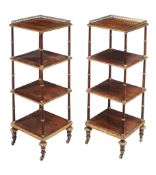 A pair of Regency rosewood and parcel gilt three tier whatnots , circa 1815   A pair of Regency