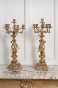 A pair of French gilt bronze six light figural candelabra in Louis XV style   A pair of French