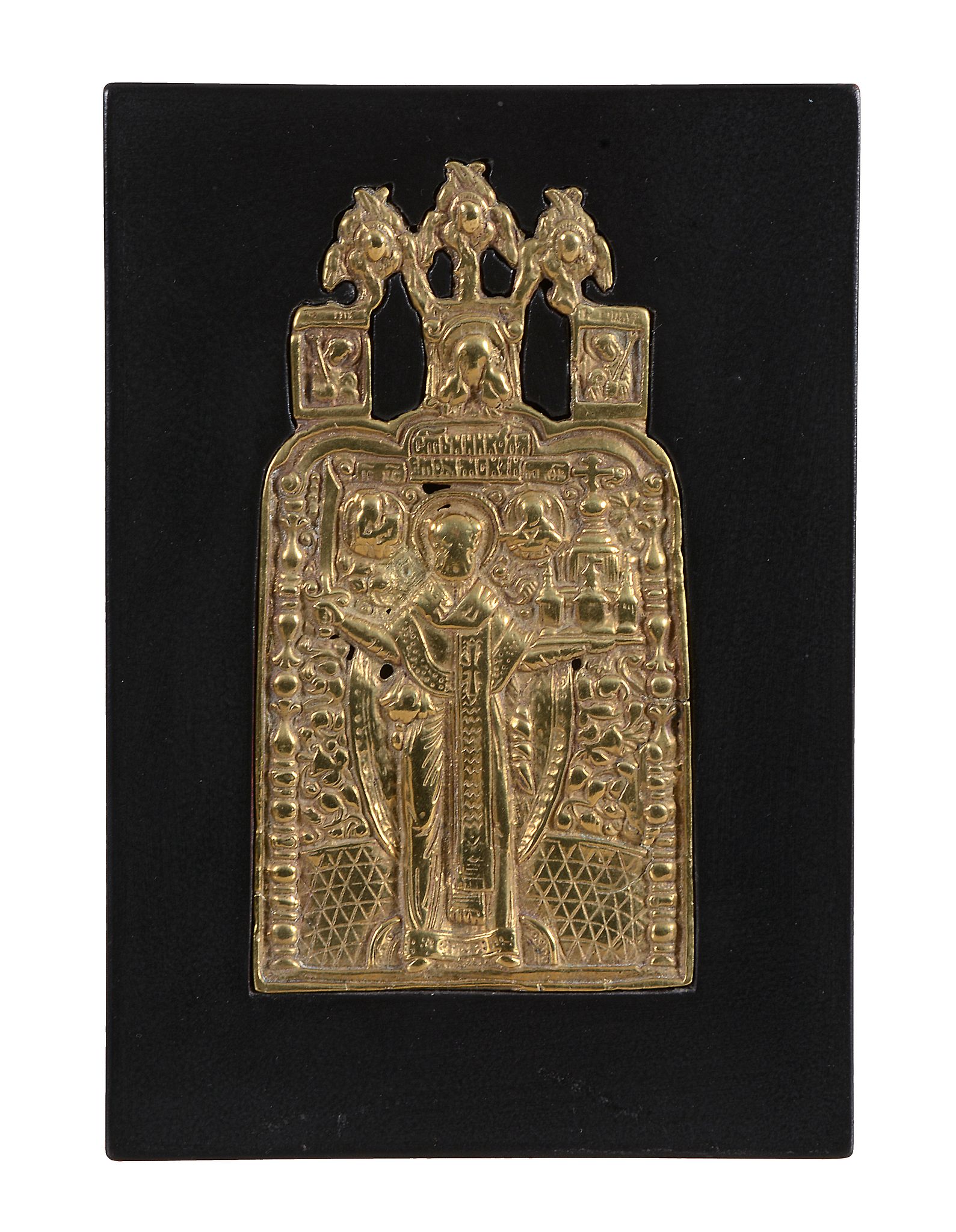 A Russian relief cast brass icon, Saint Nicholas, late 18th century   A Russian relief cast brass