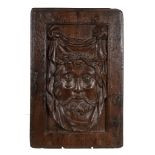 A recessed relief sculpted oak panel depicting the face of Christ, circa 1500 A recessed relief