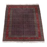 A Tabriz carpet, signed by Master Weaver Javan Amir Khiz   A Tabriz carpet,   signed by Master