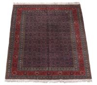 A Tabriz carpet, signed by Master Weaver Javan Amir Khiz   A Tabriz carpet,   signed by Master