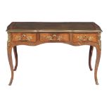 A bois satine, rosewood and gilt metal mounted bureau plat in Louis XV style   A bois satine,