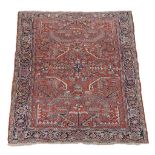 A Heriz carpet , the red field profusely decorated with geometric foliate...   A Heriz carpet  , the