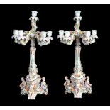 A pair of Meissen figural flower-encrusted five-branch candelabra   A pair of Meissen figural