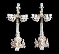 A pair of Meissen figural flower-encrusted five-branch candelabra   A pair of Meissen figural