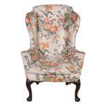 A George II mahogany and upholstered wing armchair , circa 1740   A George II mahogany and