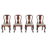 A set of four George II red walnut chairs, circa 1735   A set of four George II red walnut chairs,