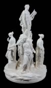 A French white biscuit porcelain allegorical group of Apollo and the muses...   A French white