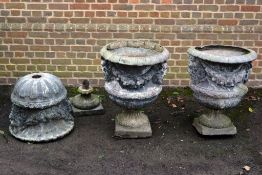 A set of three lead garden urns, probably early 19th century   A set of three lead garden urns,
