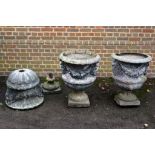 A set of three lead garden urns, probably early 19th century   A set of three lead garden urns,