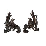 A pair of bronze chenets in Louis XV Rococo style, third quarter 19th century   A pair of bronze