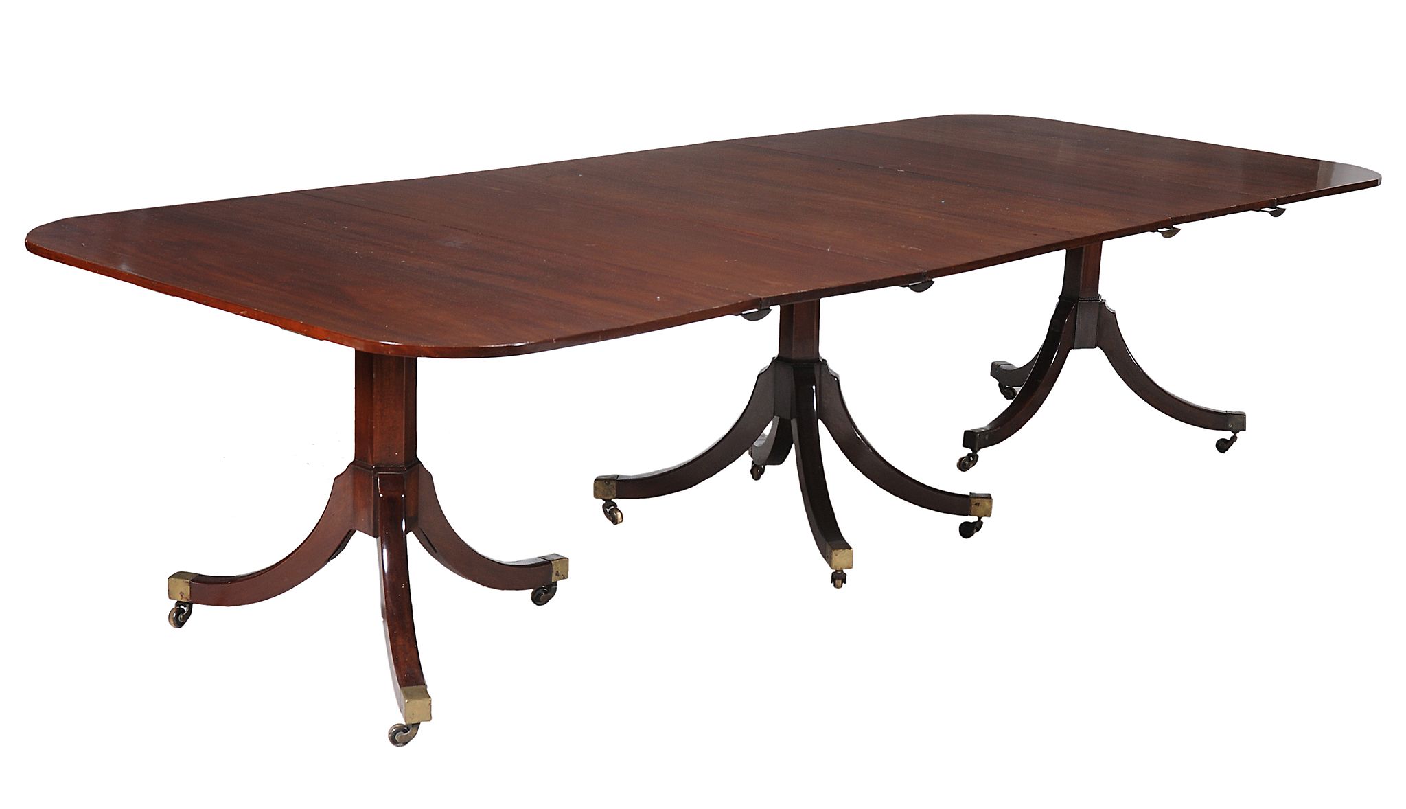 A George III mahogany triple pillar dining table , circa 1800   A George III mahogany triple