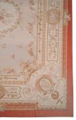 A woven carpet in Aubusson style, the central laurel medallion within the...   A woven carpet in