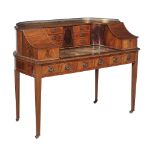 A mahogany and satinwood crossbanded Carlton House desk, in George III style   A mahogany and