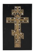 A Russian relief cast and enamelled brass processional cross, Christ Crucified   A Russian relief