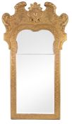 A George II giltwood and gesso wall mirror, circa 1735   A George II giltwood and gesso wall mirror,