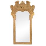 A George II giltwood and gesso wall mirror, circa 1735   A George II giltwood and gesso wall mirror,