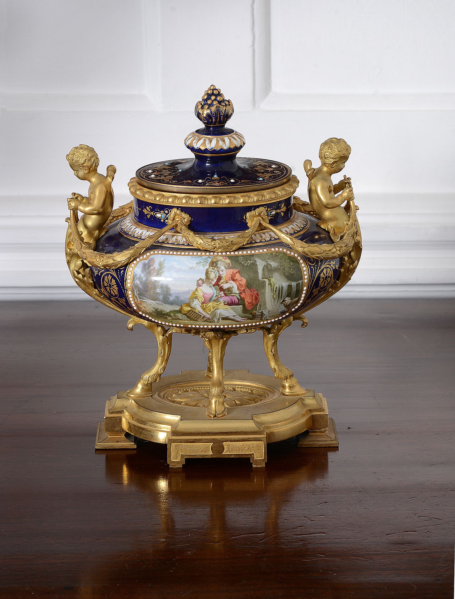 A Sèvres-style gilt-metal mounted urn and cover, late 19th century   A Sèvres-style gilt-metal