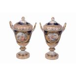 A pair of Berlin blue-ground and gilt two-handled vases and covers   A pair of Berlin blue-ground
