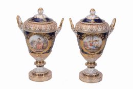 A pair of Berlin blue-ground and gilt two-handled vases and covers   A pair of Berlin blue-ground