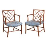 A pair of George III mahogany armchairs, circa 1810, of Cockpen type A pair of George III mahogany