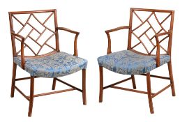 A pair of George III mahogany armchairs, circa 1810, of Cockpen type A pair of George III mahogany