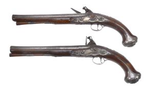 A pair of George II crested and silver-mounted walnut holster pistols by... A pair of George II