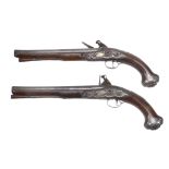 A pair of George II crested and silver-mounted walnut holster pistols by... A pair of George II