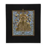 A Russian relief cast and enamelled brass icon, Saint Antipii   A Russian relief cast and