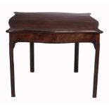 A George III mahogany serpentine folding tea table, circa 1770   A George III mahogany serpentine