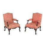 A pair of mahogany library armchairs in George II style, 19th century   A pair of mahogany library