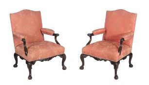 A pair of mahogany library armchairs in George II style, 19th century   A pair of mahogany library
