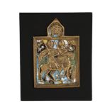 A Russian relief cast and enamelled brass icon A Russian relief cast and enamelled brass icon,