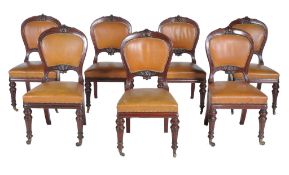 A set of seven Victorian mahogany library chairs , circa 1870   A set of seven Victorian mahogany