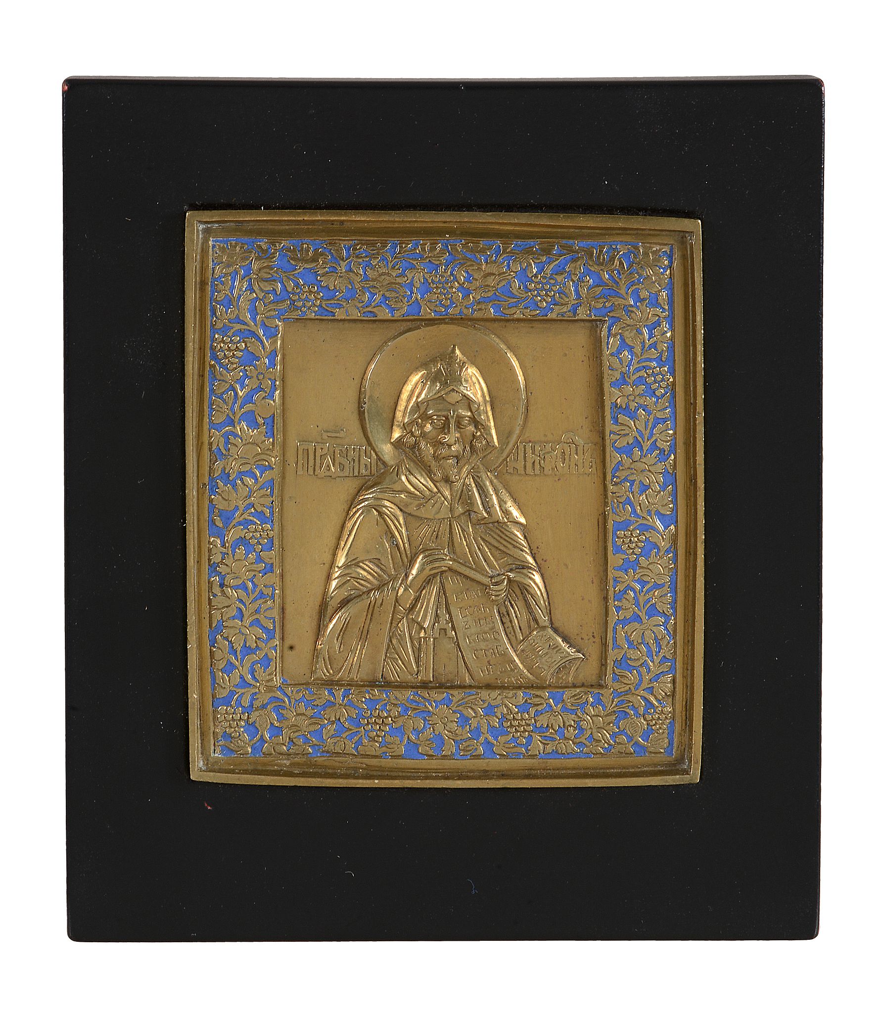 A Russian relief cast and enamelled brass icon, Saint Tryphon, circa 1800   A Russian relief cast