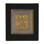 A Russian relief cast and enamelled brass icon, Saint Tryphon, circa 1800   A Russian relief cast