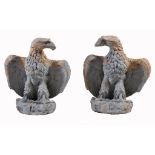 A pair of glazed stoneware pier finials modelled as spreadeagles A pair of glazed stoneware pier