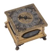 A fine Lithuanian engraved gilt brass horizontal striking table clock signed...   A fine