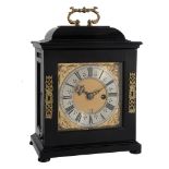 An ebony small table timepiece with silent-pull quarter-repeat on two bells...   An ebony small