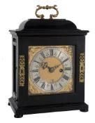 An ebony small table timepiece with silent-pull quarter-repeat on two bells...   An ebony small