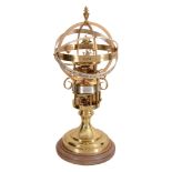 A brass pedestal timepiece 'The Orrery Clock' The St   A brass pedestal timepiece 'The Orrery Clock'