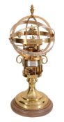 A brass pedestal timepiece 'The Orrery Clock' The St   A brass pedestal timepiece 'The Orrery Clock'