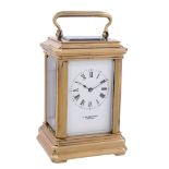 A French lacquered brass miniature carriage timepiece Retailed by J. W   A French lacquered brass